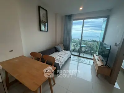 Modern living room with ocean view and balcony access