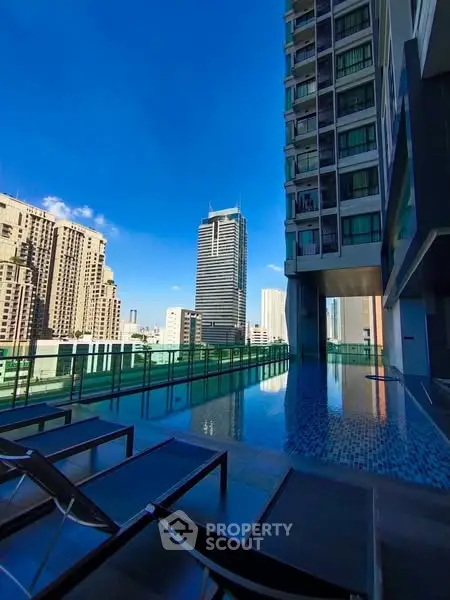 Luxurious rooftop pool with stunning cityscape views and modern architecture.