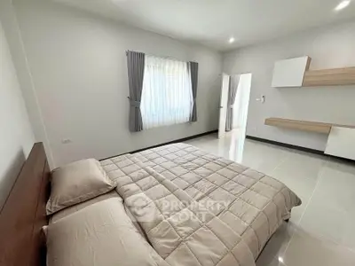 Spacious modern bedroom with minimalist design and natural light