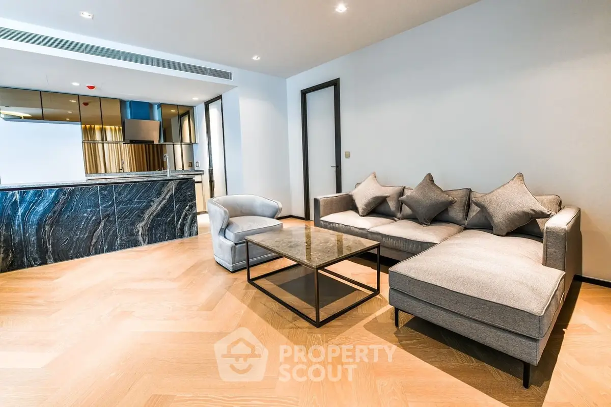 Modern living room with elegant furniture and open kitchen layout