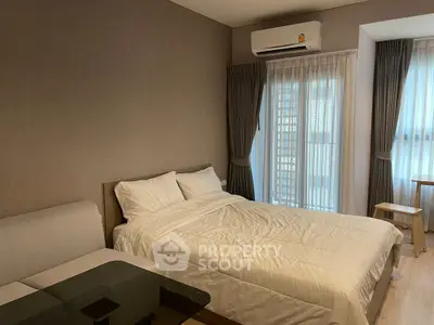 Modern bedroom with cozy bed and natural light in stylish apartment