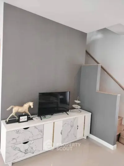 Modern living room with stylish TV stand and decorative elements