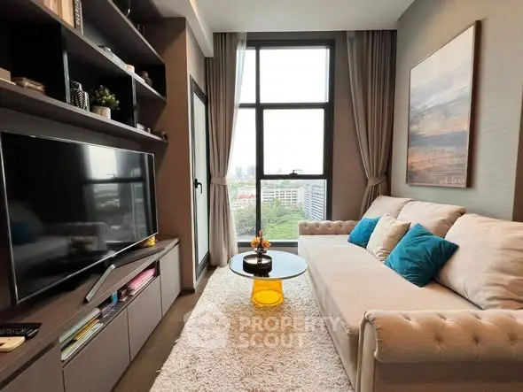 Cozy living room with modern decor and city view, featuring a plush sofa and large TV.