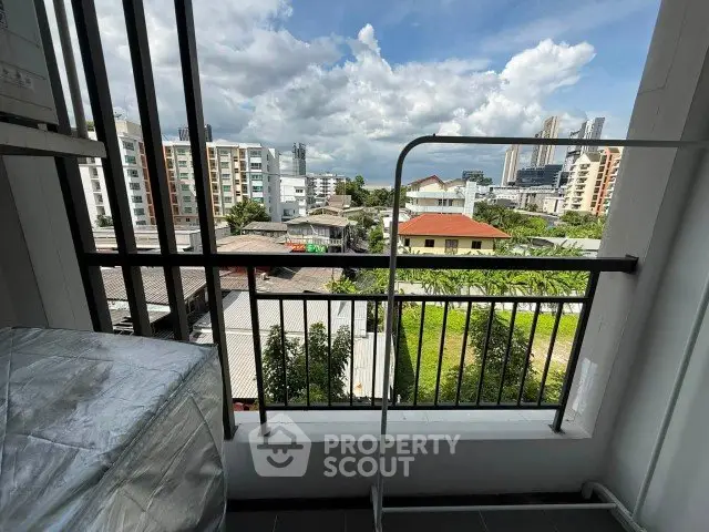 Stunning city view from a high-rise balcony, perfect for urban living.