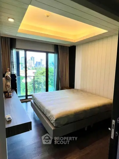 Modern bedroom with city view and stylish decor, featuring large windows and cozy ambiance.