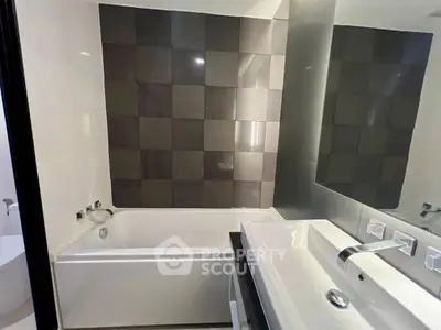 Modern bathroom with sleek design and stylish tiles
