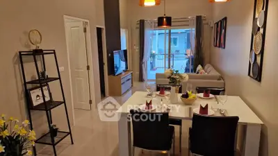 Modern living room with dining area and balcony view in stylish apartment