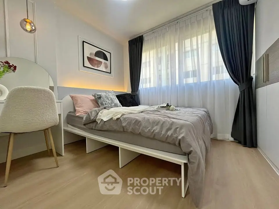 Modern bedroom with stylish decor and natural light
