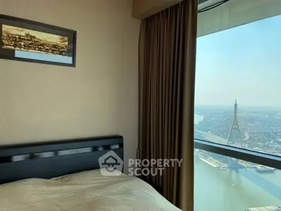 Luxurious bedroom with stunning city view from high-rise window