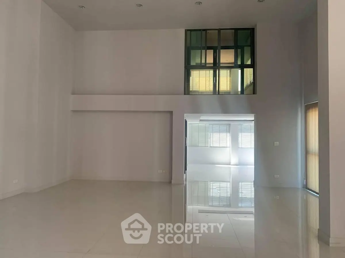 Spacious modern interior with high ceilings and large windows