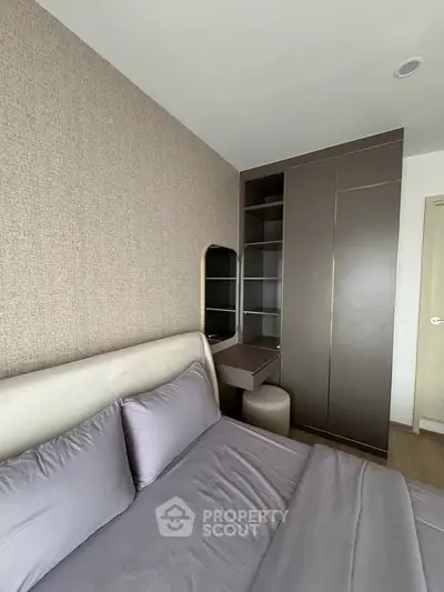 Modern bedroom with sleek wardrobe and stylish decor