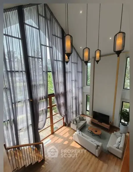 Stunning modern living room with high ceilings and large windows