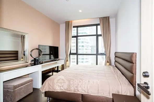 Modern bedroom with large window and stylish decor in urban apartment