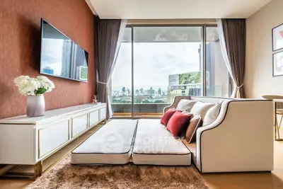Luxurious living room with city view, modern decor, and plush seating in high-rise apartment.