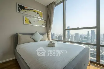 Luxurious bedroom with panoramic city view and modern decor