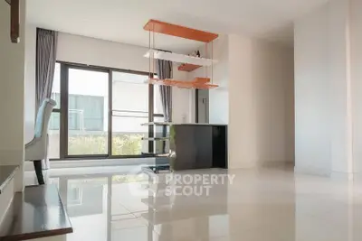 Spacious modern living room with large windows and sleek design