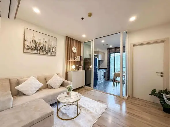 Modern living room with open kitchen and stylish decor