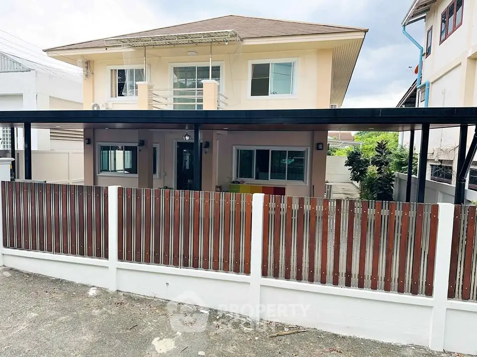 Charming two-story house with modern design and spacious fenced yard.