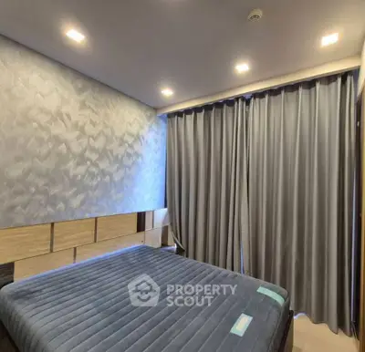 Modern bedroom with textured wall and elegant curtains