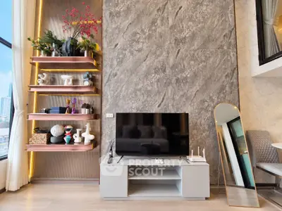 Modern living room with stylish decor and large TV, featuring elegant shelving and floor-to-ceiling windows.