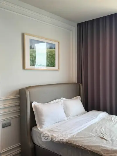 Elegant bedroom with cozy bed and stylish decor in modern apartment