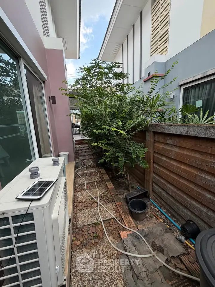 Charming outdoor garden space with lush greenery and modern exterior design, perfect for relaxation and privacy.