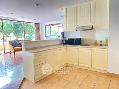 Spacious open-layout kitchen with modern appliances and natural light, perfect for culinary enthusiasts.