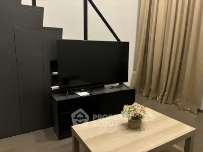 Modern living room with sleek TV setup and elegant decor