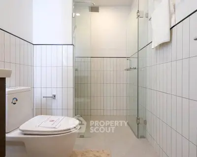 Modern bathroom with glass shower and sleek tile design