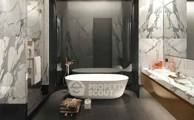 Luxurious marble bathroom with freestanding tub and elegant fixtures