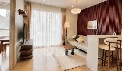 Modern living room with stylish decor and open layout, featuring a cozy seating area and elegant lighting.