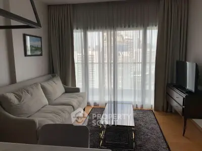 Modern living room with cozy sofa, sleek coffee table, and large window with city view.