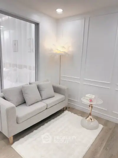 Elegant living room with modern gray sofa and chic floor lamp