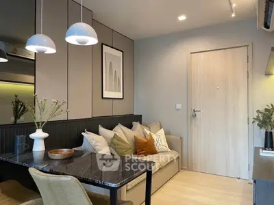 Modern living room with stylish decor and cozy seating area, perfect for relaxation and entertaining.