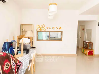 Spacious living room with modern decor and unique wall art, perfect for family gatherings.