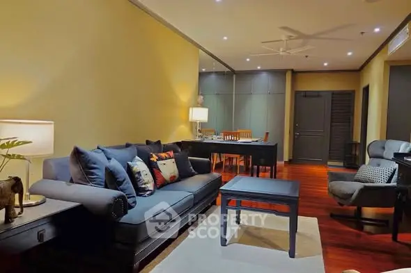 Elegant living room with stylish furniture and warm lighting, perfect for relaxation and entertainment.