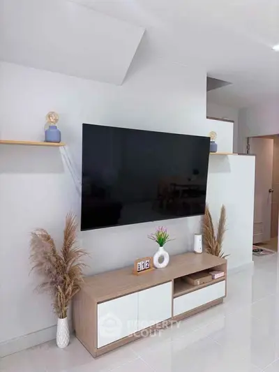 Modern living room with sleek TV setup and stylish decor
