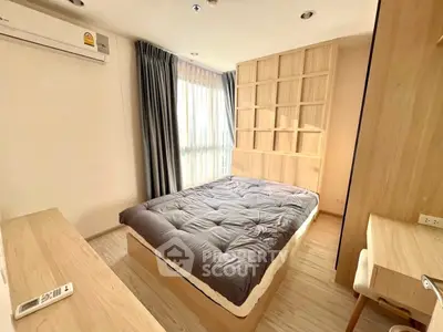 Modern bedroom with natural light and stylish wooden furnishings
