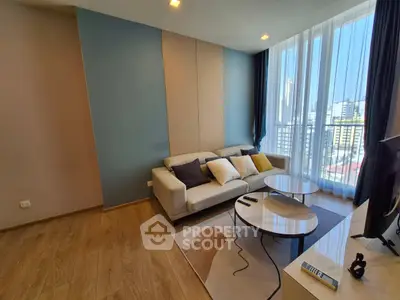 Modern living room with stylish decor and city view from large windows