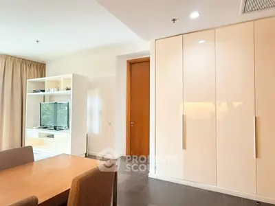 Spacious living room with modern furniture and built-in storage