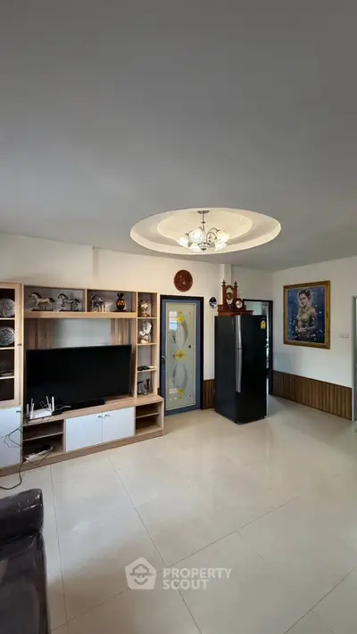 Spacious living room with modern decor and built-in entertainment center