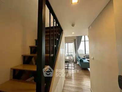 Modern duplex with stylish staircase and spacious living area