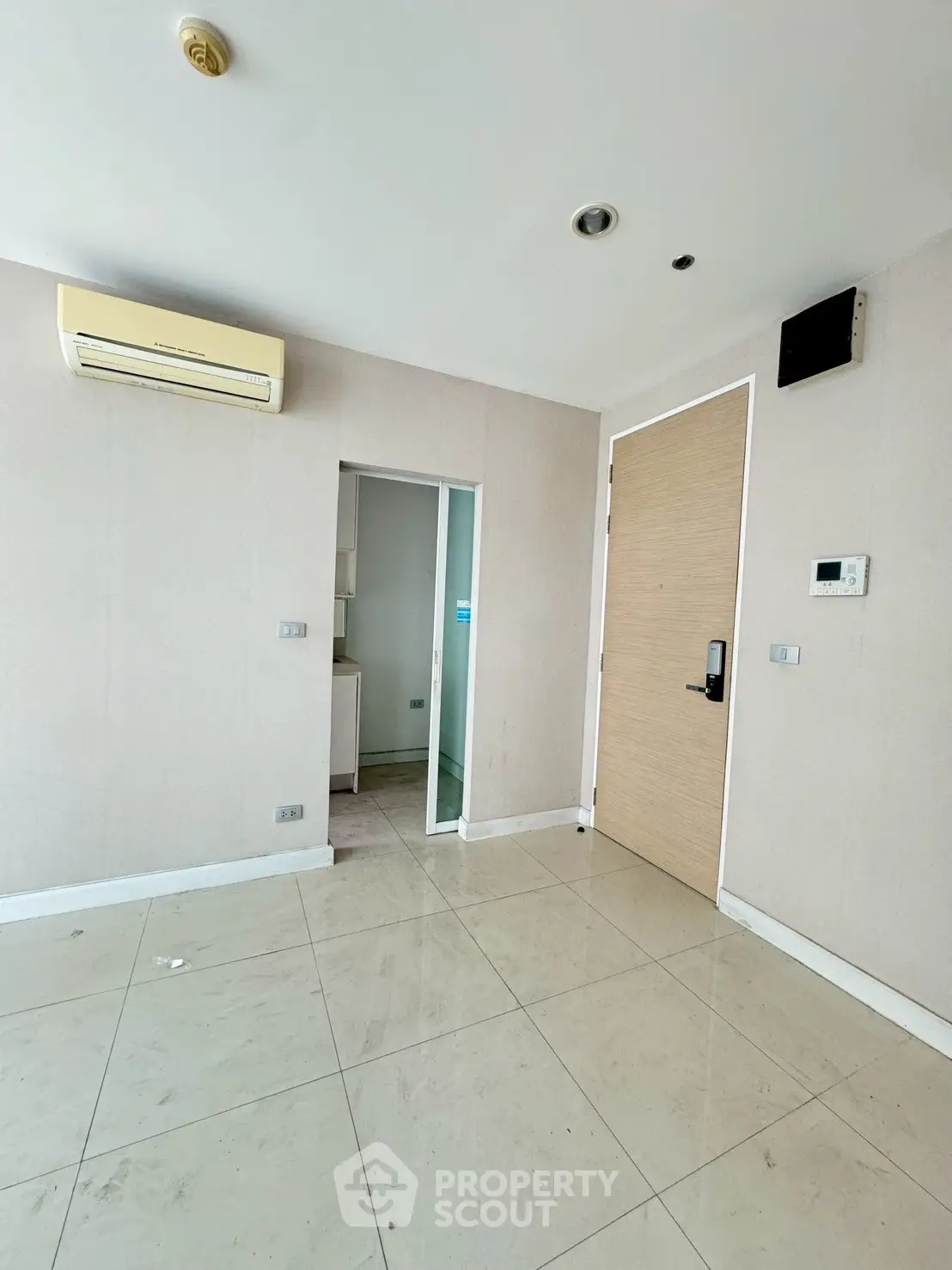 Spacious interior with air conditioning and modern door, ideal for customization.