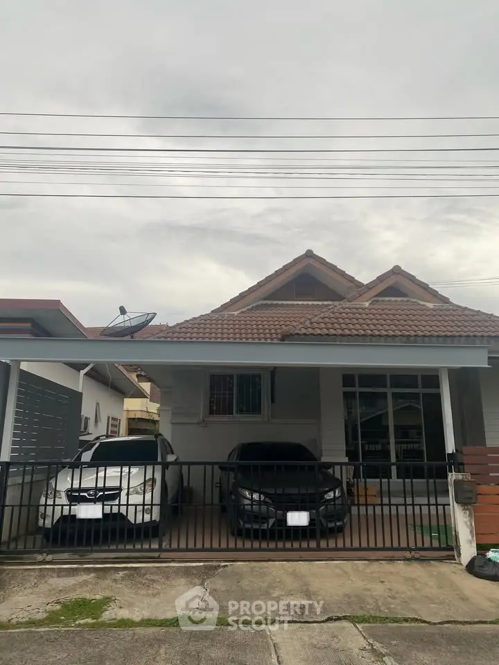 Charming suburban house with tiled roof and double carport, perfect for family living.