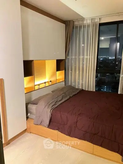 Modern bedroom with city view and stylish lighting