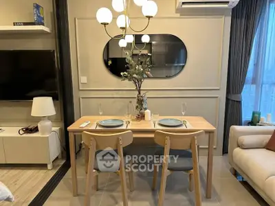 Modern dining area with elegant lighting and stylish decor in a cozy apartment setting.