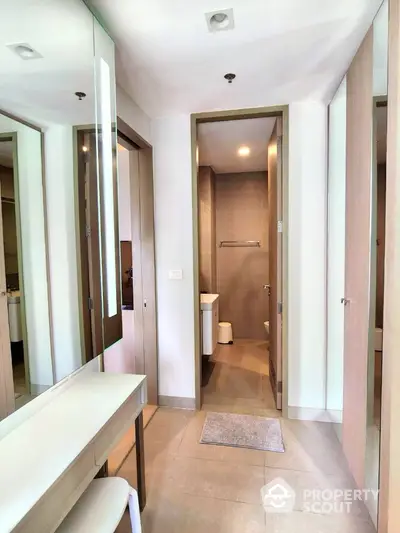 Modern bathroom with sleek design and ample natural light