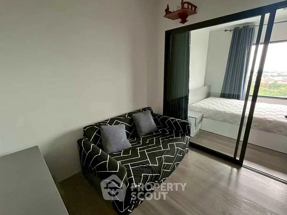 Modern apartment with cozy living area and bedroom view