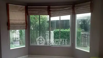 Spacious corner unit with large windows offering lush garden views, perfect for natural light lovers.