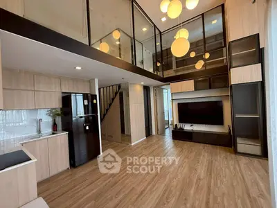 Modern duplex living room with high ceilings and stylish lighting